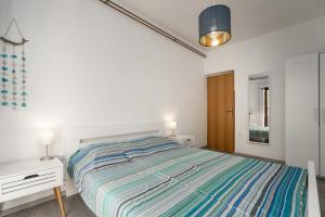 Postel nebo postele na pokoji v ubytování Ohana Lodge