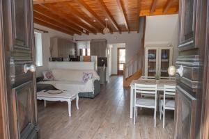 a living room with a couch and a table at Galinos-traditional house B in Eresos