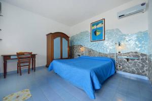 Кровать или кровати в номере Azzurromare Residence