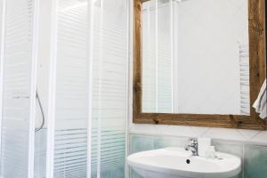a bathroom with a sink and a mirror at Polka in Chojnice