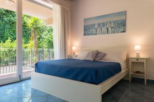 En eller flere senge i et værelse på CefalHome - MAGARÀ