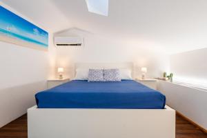 En eller flere senge i et værelse på CefalHome - MAGARÀ