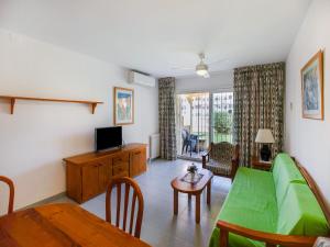 A television and/or entertainment centre at Lovely Apartment near Seabeach