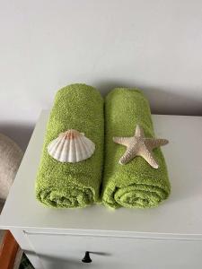 two towels and a starfish on a table at Siedlisko Kierzkowo in Kierzkowo +122 photos