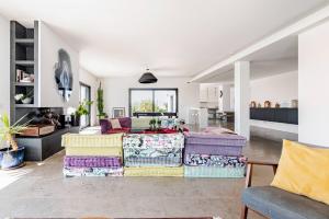 a living room with a couch and a table at Bica Vista in Lourinhã