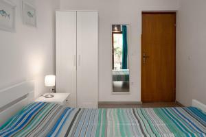 Postel nebo postele na pokoji v ubytování Ohana Lodge