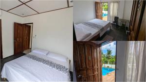 una camera d'albergo con due letti e una piscina di PalomaVilla Resort a Panglao Altre 36 foto