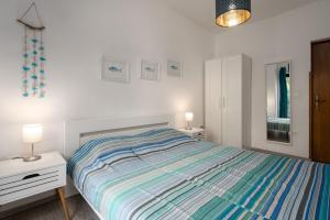 Postel nebo postele na pokoji v ubytování Ohana Lodge
