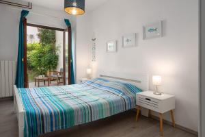 Postel nebo postele na pokoji v ubytování Ohana Lodge
