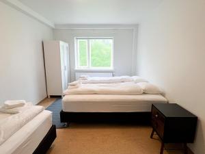 Voodi või voodid majutusasutuse Eiðar - Apartments toas