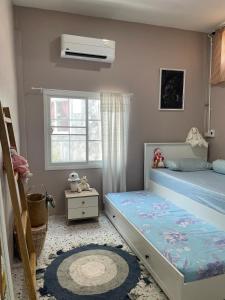 Ένα ή περισσότερα κρεβάτια σε δωμάτιο στο DADDYs ON Home Lopburi