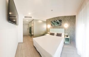 Posteľ alebo postele v izbe v ubytovaní Hotel Clopy Rocamar