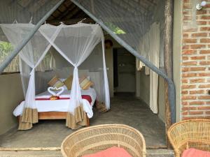 Voodi või voodid majutusasutuse Zua Safari Lodge toas