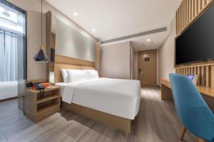 Postel nebo postele na pokoji v ubytování Atour X Hotel Beijing Sanyuan Bridge