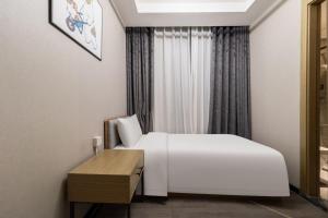 Postel nebo postele na pokoji v ubytování Atour X Hotel Beijing Sanyuan Bridge