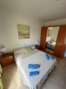 Ένα ή περισσότερα κρεβάτια σε δωμάτιο στο Apartamento Arousa