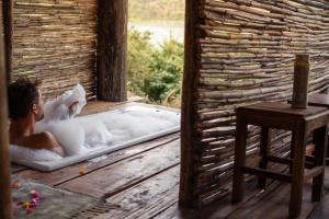 Voodi või voodid majutusasutuse Zua Safari Lodge toas