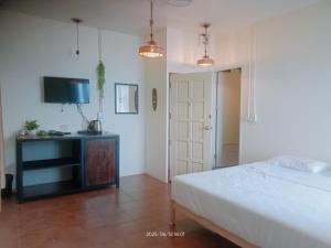 Postel nebo postele na pokoji v ubytování Tchin tchin Guesthouse