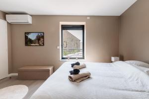 Postel nebo postele na pokoji v ubytování Le Vignoble