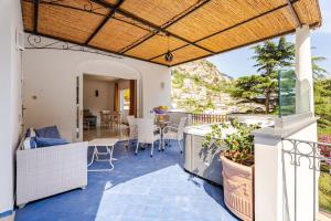 an outdoor patio with a wooden pergola at Villa Alimede in Positano