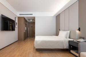 TV a/nebo společenská místnost v ubytování Atour Hotel Guangzhou Yueqiao Branch
