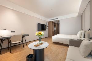 TV a/nebo společenská místnost v ubytování Atour Hotel Guangzhou Yueqiao Branch