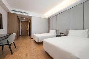 Postel nebo postele na pokoji v ubytování Atour Hotel Guangzhou Yueqiao Branch