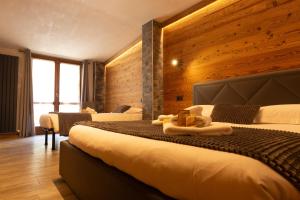 Postel nebo postele na pokoji v ubytování Hotel Valle Pesio Ristorante
