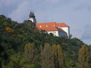 a building on top of a hill with a castle at Holiday home in Balatonfüred 18777 in Balatonfüred