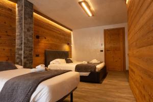 Postel nebo postele na pokoji v ubytování Hotel Valle Pesio Ristorante