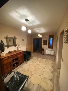 a large living room with a large rug at Villa Doble M in Cervera de Pisuerga
