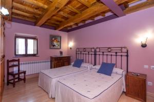 Postel nebo postele na pokoji v ubytování Casa Fuente del Val