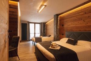 Postel nebo postele na pokoji v ubytování Hotel Valle Pesio Ristorante