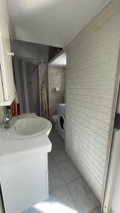 a bathroom with a sink and a toilet at Dimora Marina sul Gargano in Vieste +18 photos