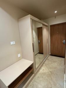 a empty room with a closet and a mirror at JRV Residence in Ambāsamudram