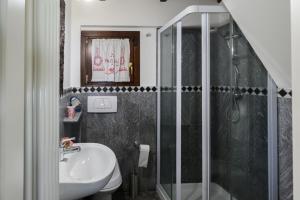 a bathroom with a shower and a sink at Villa Gia in Someraro