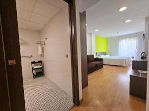 Posteľ alebo postele v izbe v ubytovaní Hotel Clopy Rocamar