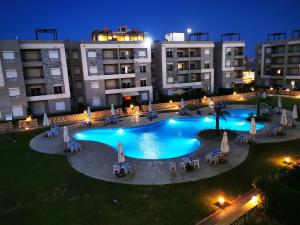 an image of a swimming pool at night at Sea Front Zen Chalet Families Only in Marsa Matruh