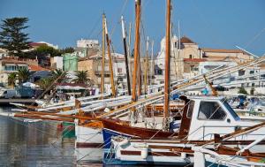 a group of boats docked in a harbor at Casa vacanze al mare in Sardegna in Calasetta +13 photos