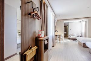 Voodi või voodid majutusasutuse Hanting Hotel Shanghai Lujiazui Pudong South Road toas