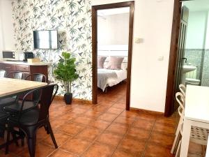 Postel nebo postele na pokoji v ubytování RIBERA SUITE CÓRDOBA