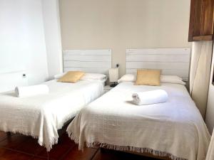 Postel nebo postele na pokoji v ubytování RIBERA SUITE CÓRDOBA