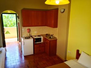 A kitchen or kitchenette at Chrissas Apartments