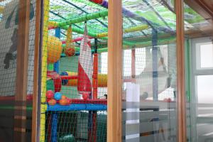 a play room with a play equipment in a room at Hotel Villa de Ares in Ares