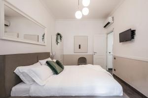A television and/or entertainment centre at The Best Rent - Apartment in Testaccio district