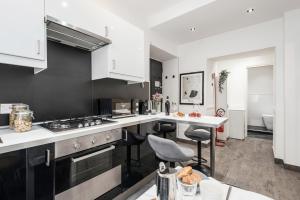 A kitchen or kitchenette at The Best Rent - Apartment in Testaccio district
