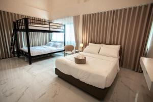 a bedroom with a bed and a bunk bed at Khunnapat Pool Villa Khaoyai in Mu Si +17 photos