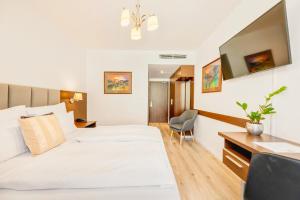 Voodi või voodid majutusasutuse Hotel ANTARES toas