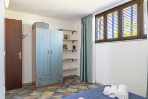 Postel nebo postele na pokoji v ubytování Alisei Family House