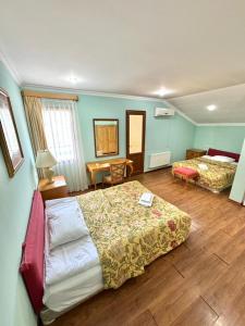 Postel nebo postele na pokoji v ubytování Hotel Lileo